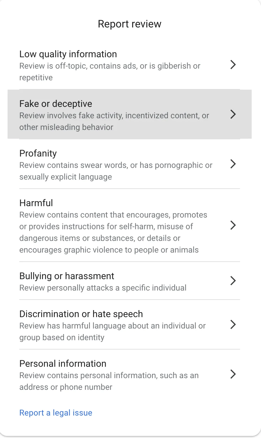 Google review report form showing seven violation categories: Low quality information, Fake or deceptive, Profanity, Harmful, Bullying or harassment, Discrimination or hate speech, Personal information, plus Report a legal issue link