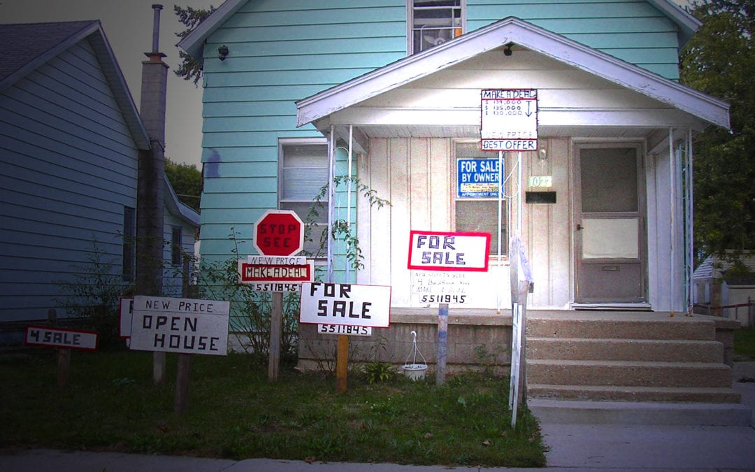 For Sale by Owner Home with Many signs that look crazy