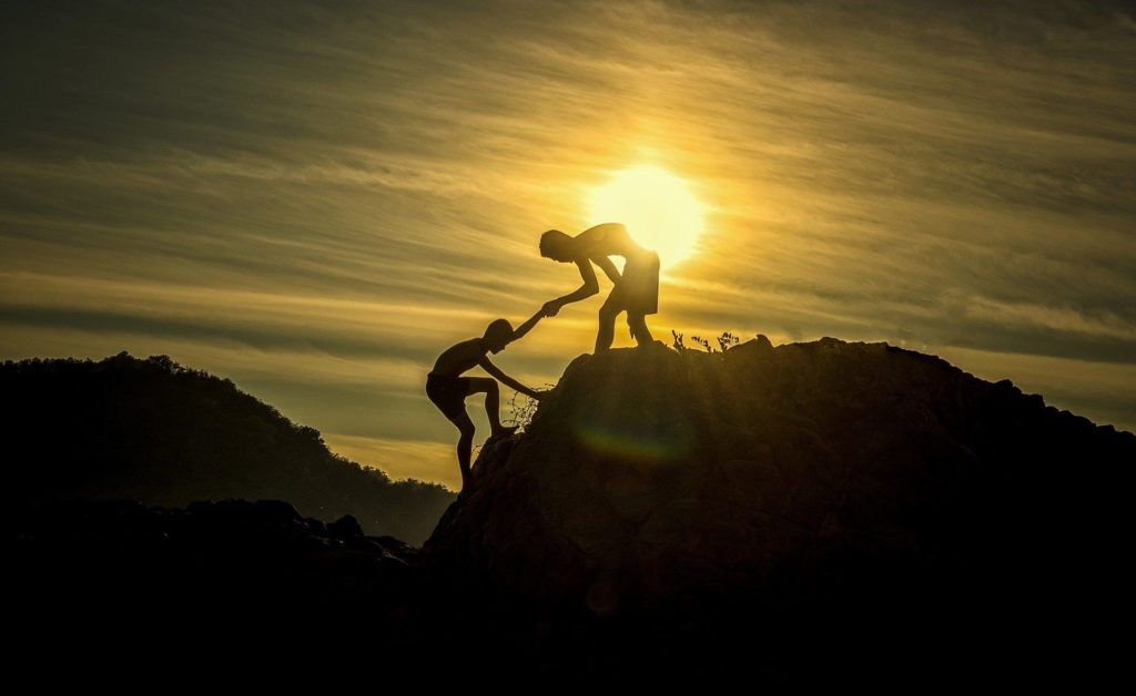 two people climbing a mountain hand in hand for short sale rescue illustration