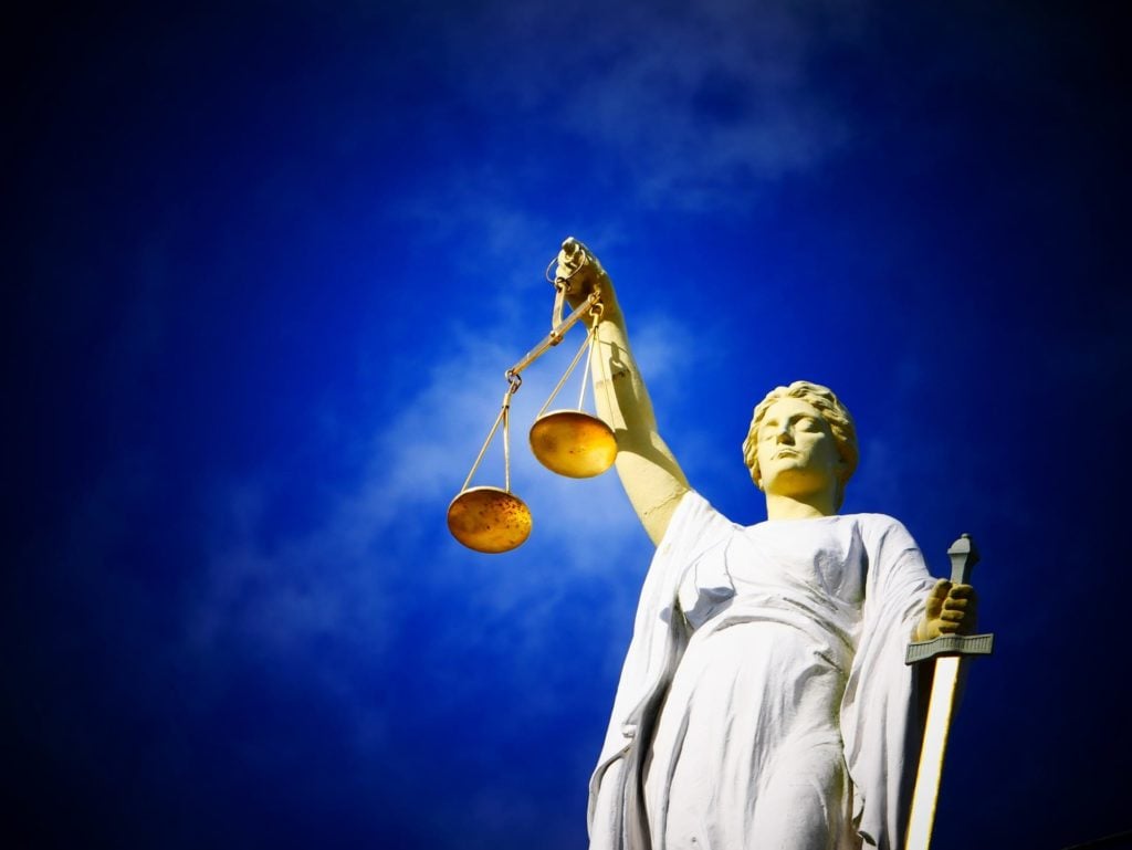 lady justice holding the scales for illustration of courtroom foreclosure attorney
